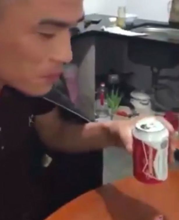 Man-swigs-back-a-beer-before-eating-live